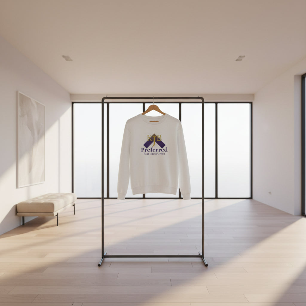 Child wearing a white sweatshirt with KJB Preferred Real Estate Group logo on a white background